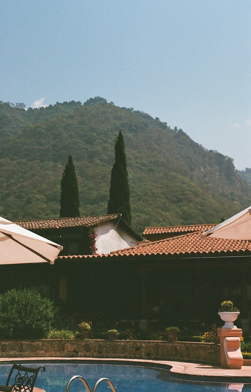 Poolside cabana chairs overlooking the mountains, Guatemala